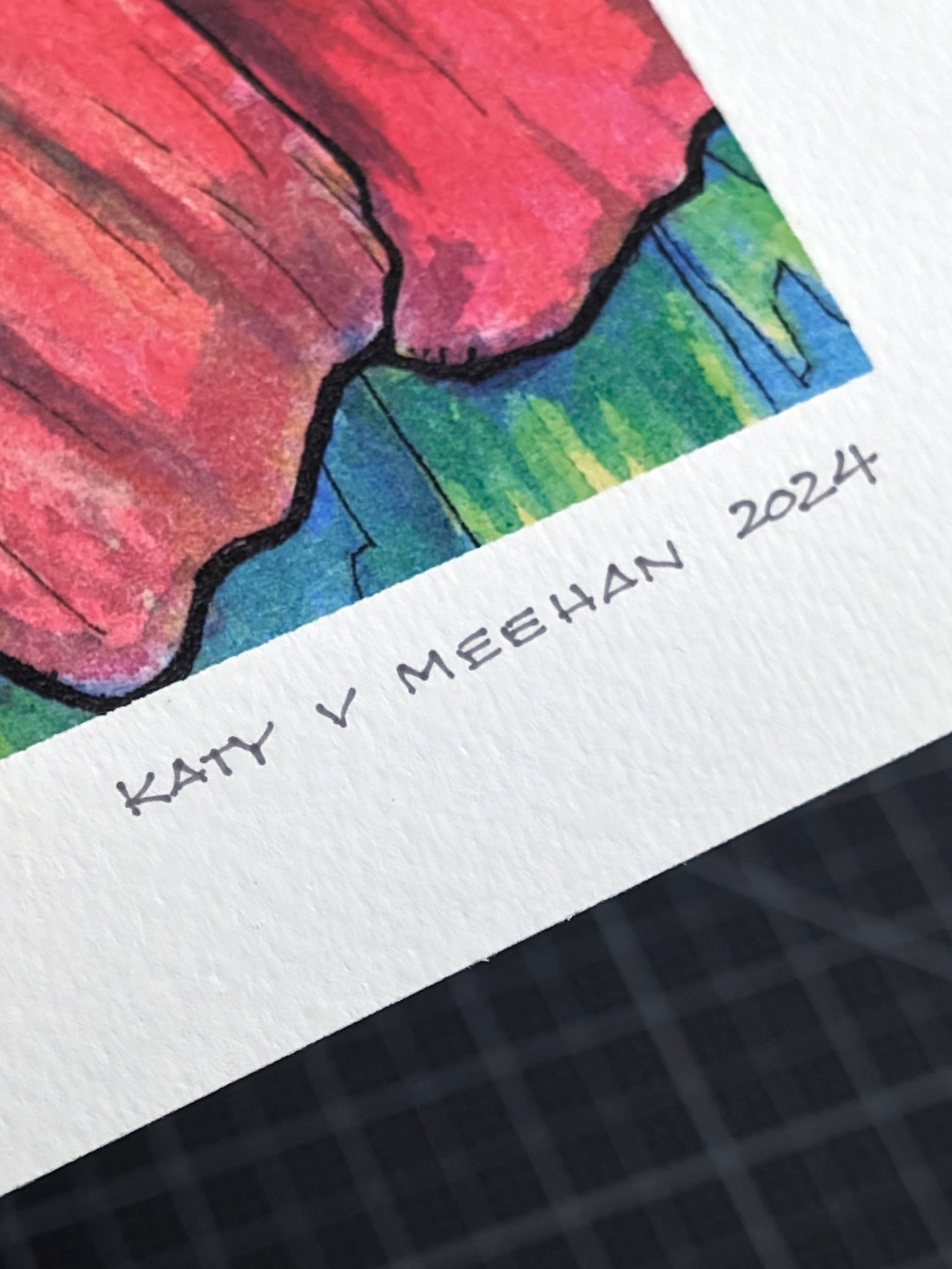 This is a photo showing a close-up view of a signed limited edition art print. The original artwork was created with india ink on watercolor paper by artist Katy V. Meehan. This print is of a hand painted rendering of a flower. The artwork is titled, ‘State Fair Zinnia’.